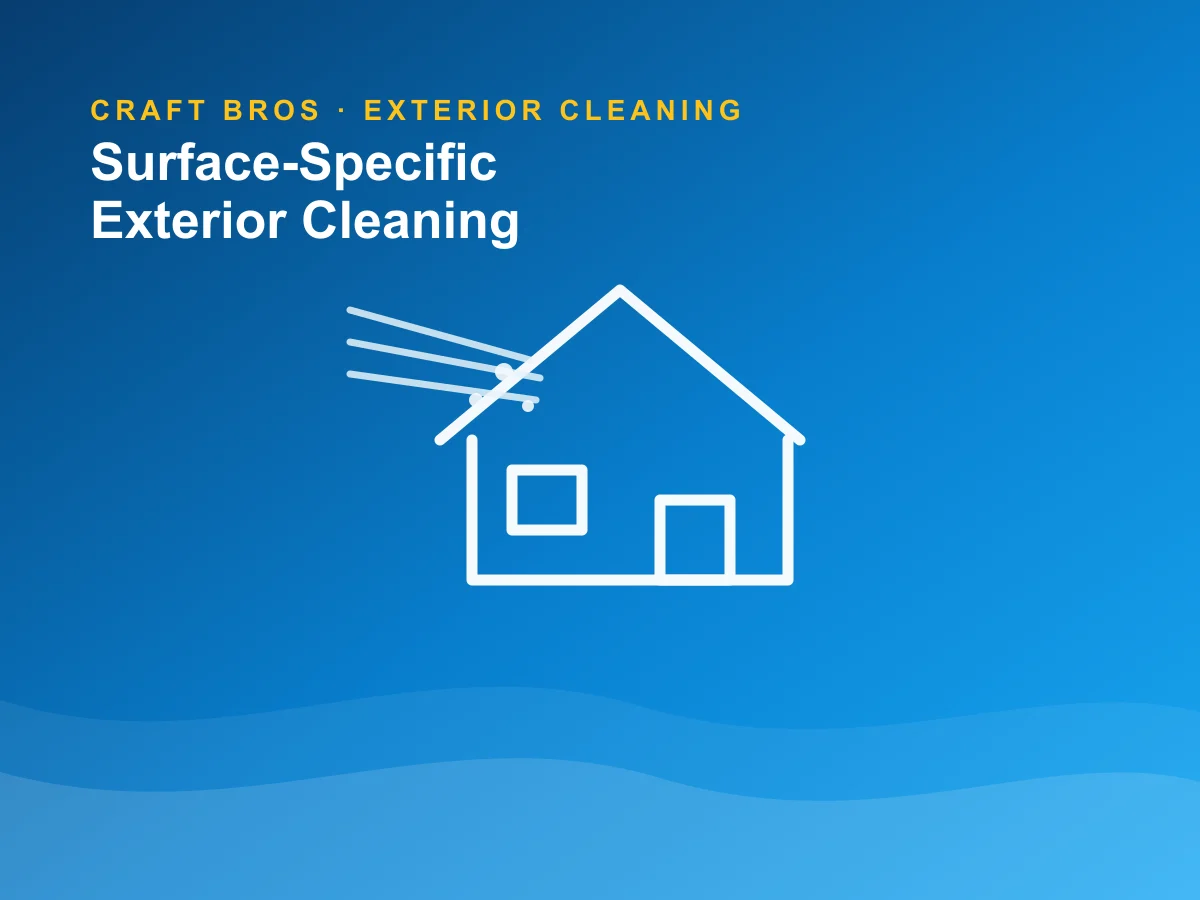 Exterior-cleaning crew safely soft washing a New England Colonial home in Longmeadow.